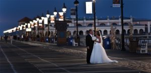 bride and groom on boardwalk