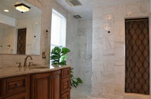 Suite bathroom with marble walls and floors