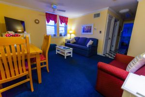 suite living area with blue carpets