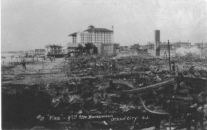 Vintage photo featuring the flanders standing amongst a burnt down boardwalk