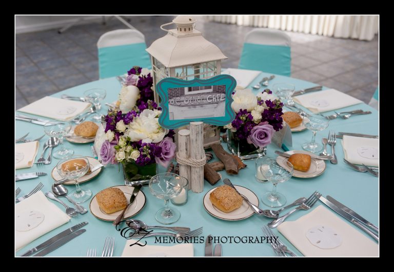 garden room table setup; teals with lantern centerpieces