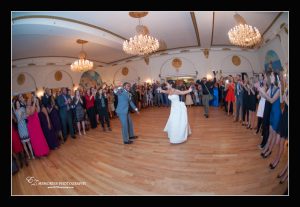 bride and groom dancing in crystal ballroom