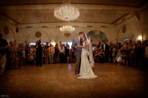bride and groom first dance in crystal ballroom