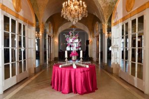 hall of mirrors with pink placecard table