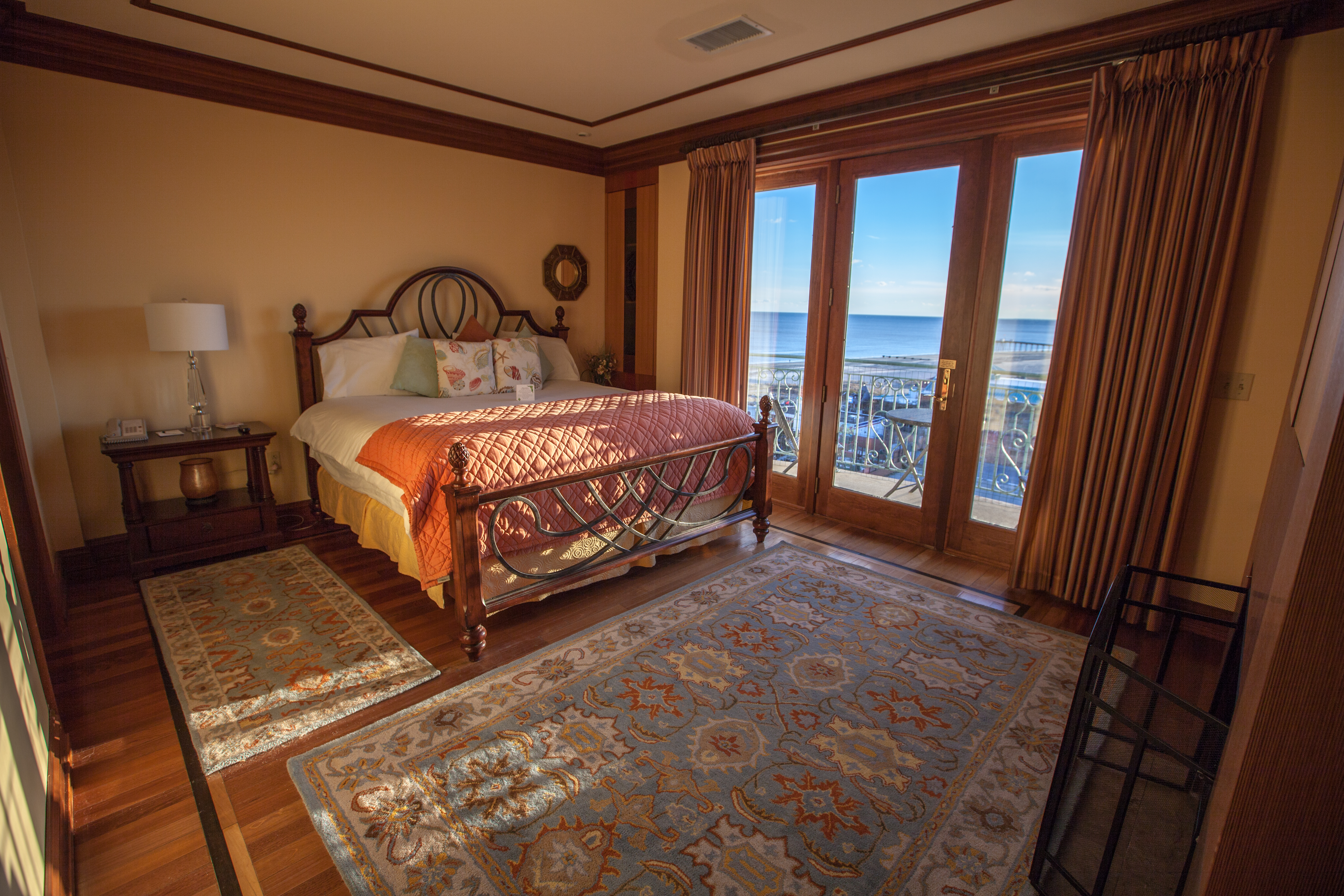 Penthouse bedroom with skyrise view of the ocean from patio