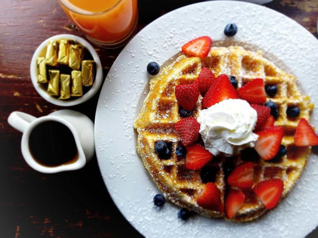 Photo: Belgian Waffle topped with fruit and whipped cream