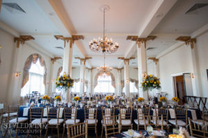 candlelight ballroom with navy and sunflower decor