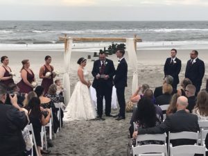 Bride and Groom at their wedding ceremony on the beach