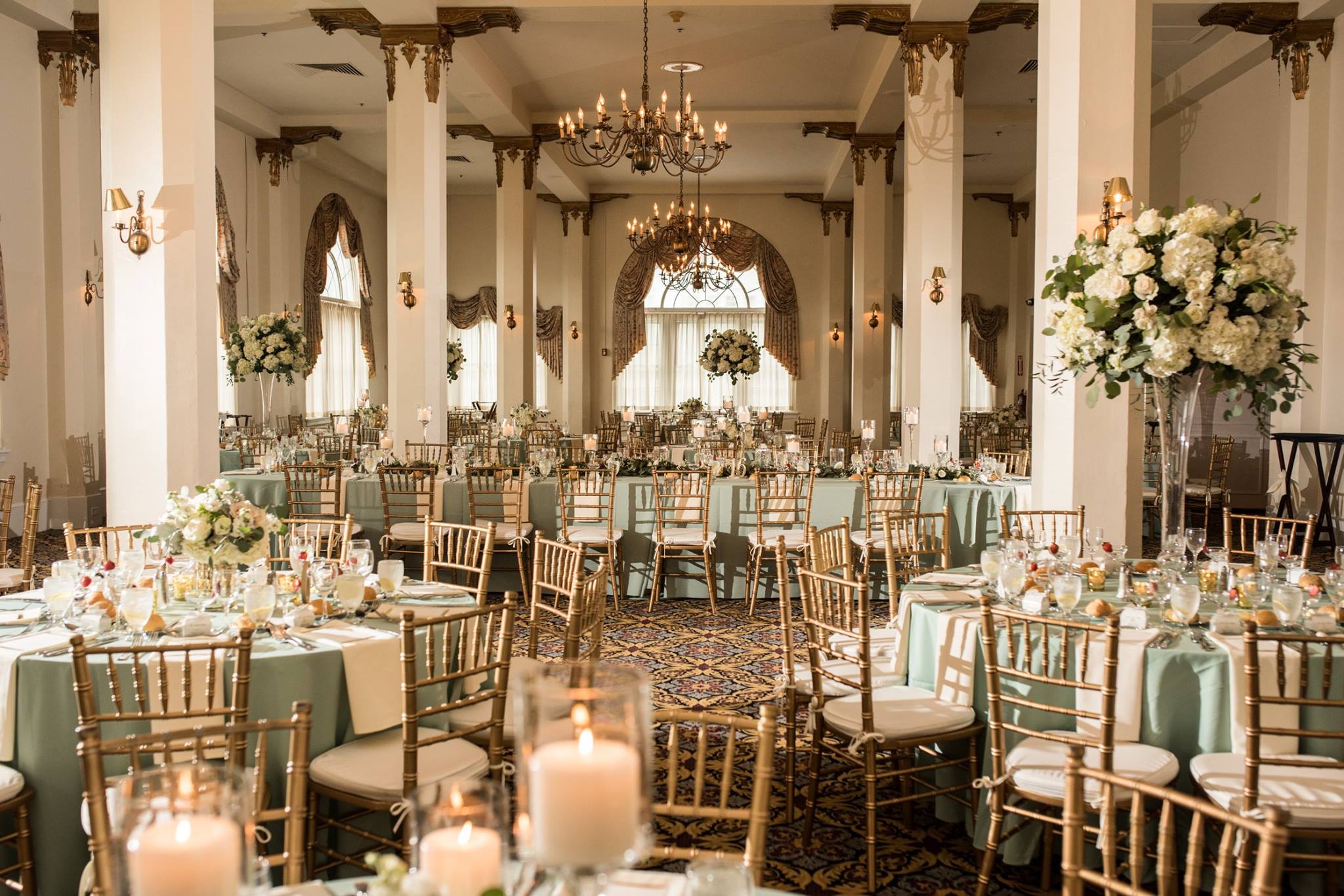 interior of candlelight ballroom, green and gold decor