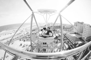 Black and white photo of couple on ferris wheel